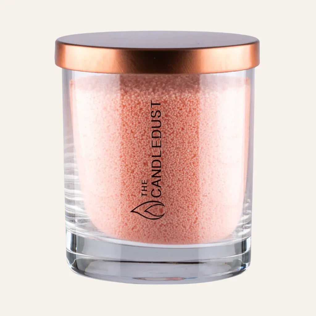 IdĂ©es cadeaux bougie dĂ©corative sable pĂȘche Candledust en verre, idĂ©ale pour une dĂ©coration de maison douce et Ă©lĂ©gante.