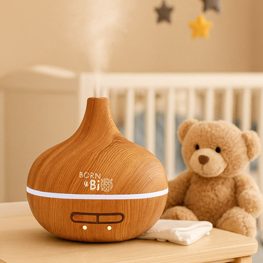 Idées cadeaux pour chambre bébé avec diffuseur d’huiles essentielles en bois, idéal pour jeunes parents ou nouveau-nés.